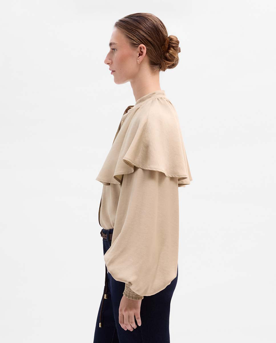 Blusa capa manga abullonada